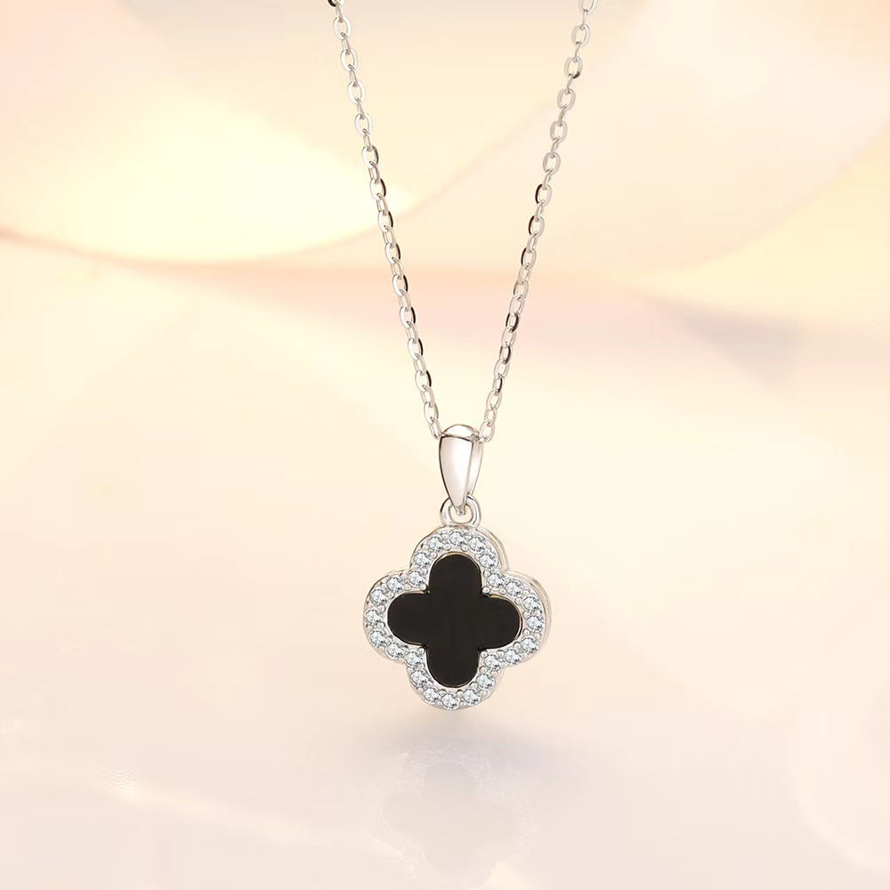 Black and white four-leaf clover necklace