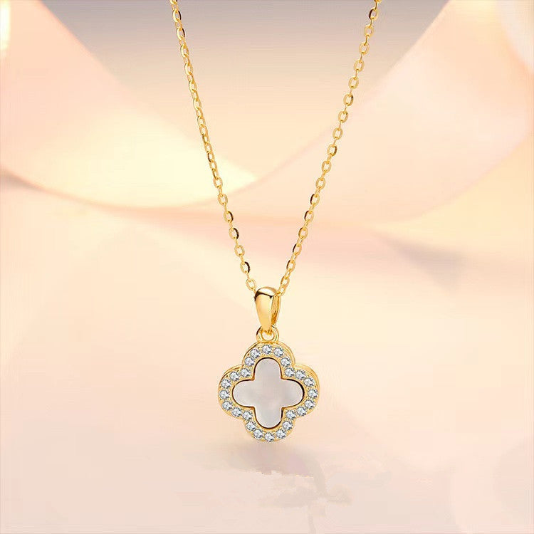 Black and white four-leaf clover necklace