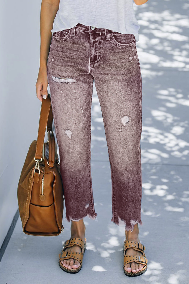 Jeans rasgados com bainha crua e cintura média e perna reta